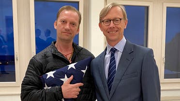 Michael White with US special envoy for Iran Brian Hook in Switzerland, June 4, after White's release. (US State department via AP)