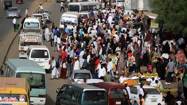 Sudanese residents wait for buses on a street in Khartoum, Sudan, May 4, 2019. (Reuters)
