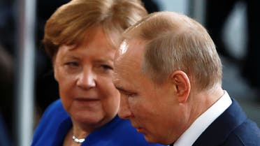 German Chancellor Angela Merkel talks with Russian President Vladimir Putin as he arrives for the Libya summit in Berlin, Germany, January 19, 2020. REUTERS/Michele Tantussi