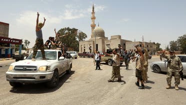 Fighters loyal to the UN-recognised Libyan Government of National Accord (GNA) celebrate together in the Qasr bin Ghashir district south of the Libyan capital Tripoli on June 4, 2020, after the area was taken over by pro-GNA forces following clashes with rival forces loyal to strongman Khalifa Haftar. The GNA said on June 4 that it was back in full control of the capital and its suburbs after more than a year of fighting off an offensive by eastern strongman Khalifa Haftar. The announcement came after GNA forces retook the capital's civilian airport the previous day, more than a year after losing it in Haftar's initial drive on the capital.