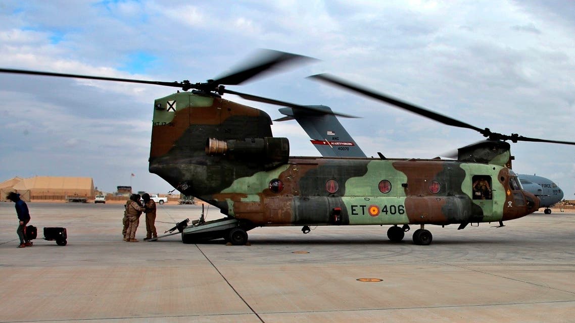In this Jan. 13, 2020 file photo, a US Air Force plane, background, lands at Ain al-Asad air base, in Anbar, Iraq. (AP)