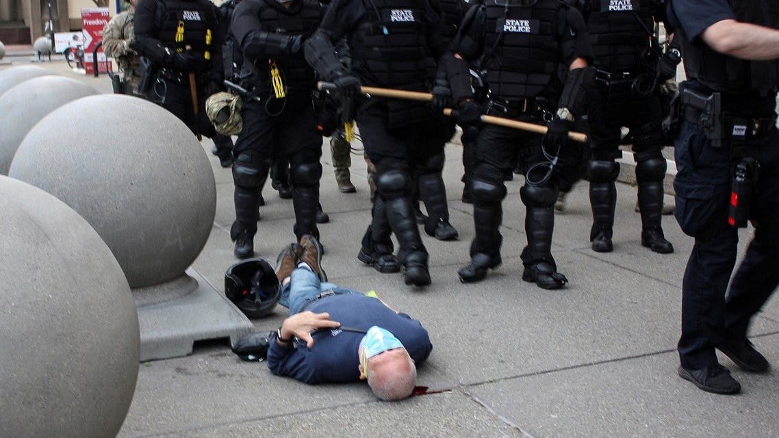 Martin Gugino lays on the ground after he was shoved by two Buffalo, New York, police officers during a protest. (Reuters)