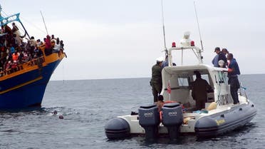 Tunisian coast guards rescue African migrants stranded on a boat coming from Libya, near Sfax, on the Tunisian coast, on June 4, 2011. (File photo: AFP)