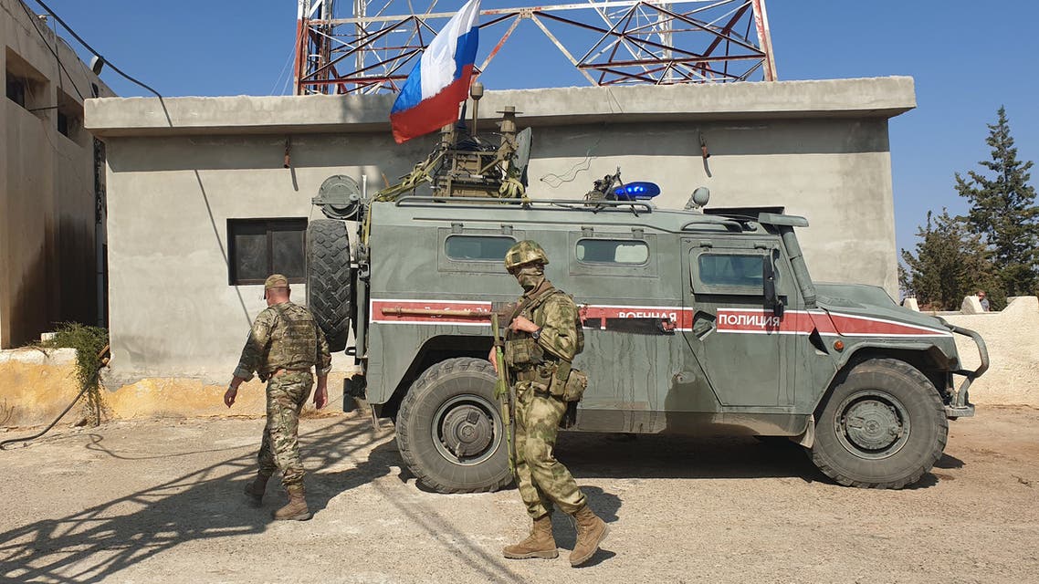 Russian military police vehicles drive in a joint patrol with the Syrian Kurdish Asayish internal security forces in the town of Kobane, also known as Ain al-Arab, in the north of Syria's Aleppo province on October 25, 2019.
