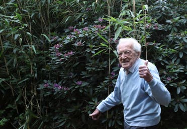 Alfons Leempoels walks in his garden intending to cover a distance equivalent of a marathon to raise money for scientists researching the coronavirus disease in Rotselaar, Belgium June 9, 2020. (Reuters)