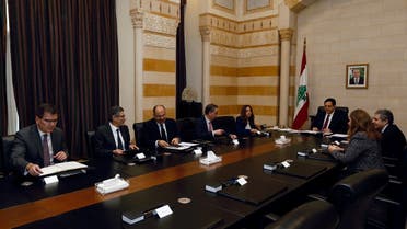 Lebanese Prime Minister Hassan Diab and officials meet with a team of IMF experts at the government palace in Beirut. (Reuters)