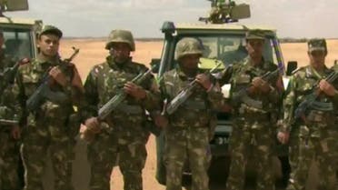 An image grab taken from footage provided by Algeria's Ennahar TV on January 18, 2013 and filmed in June 2012 shows Algerian soldiers preparing for a patrol in the desert at an undisclosed location in the south of the country. Algeria came under mounting international criticism on January 18, 2013 as fears grew for dozens of foreign hostages still unaccounted for after a deadly commando raid against their Islamist captors at a desert gas field. The Islamist militants had seized hundreds of hostages at the field deep in the Sahara, purportedly to avenge a French-led offensive in neighbouring Mali. AFP PHOTO/ENNAHAR TV