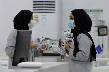 Bahraini health workers are pictured at the Sitra field Intensive Care Unit (ICU) hospital for COVID-19 patients, on May 4, 2020 in Sitra island south of the Bahraini capital Manama. (AFP)