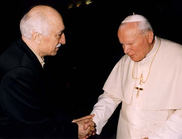 Turkey's Muslim spiritual leader Fethullah Gulen, at left, shakes hands with Pope John Paul II as they meet at the Vatican on February 9, 1998. (AP)