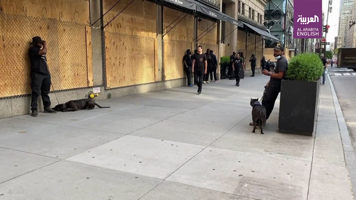 Saks Fifth Avenue is wrapped in razor wire to prevent looting