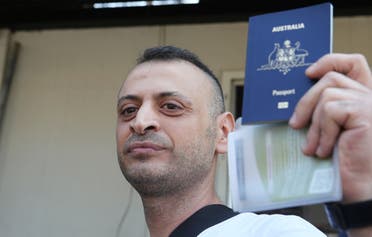 Lebanese-Australian man, Amer Khayat, holds his Australian passport as he is released from Lebanon's Roumieh prison in September 20, 2019. (Reuters)