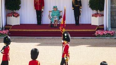 The Queen views a military ceremony by soldiers from the 1st Battalion Welsh Guards in the Quadrangle of Windsor Castle in Windsor, west of London on June 13, 2020. (AFP)