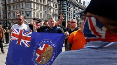 Paul Goulding, leader of a far-right political group Britain First, poses for a picture with Britain First’s flag ahead of a Black Lives Matter protest in London, Britain, June 13, 2020. (Reuters)