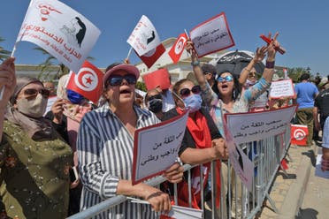 Supporters of the Free Destourian Party (PDL) rally against Assembly President Rached Ghannouchi outside the Tunisian parliament in Tunis on June 3, 2020. Ghannouchi, leader of the Islamist-inspired Ennahdha party, overshadows the President of the Republic Kais Saied on the diplomatic scene, a sign of deep tensions despite the sacred union during the health crisis.