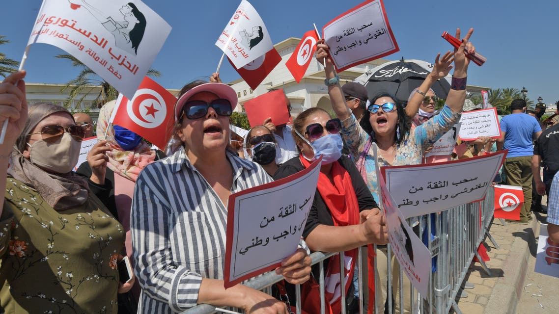 Supporters of the Free Destourian Party (PDL) rally against Assembly President Rached Ghannouchi outside the Tunisian parliament in Tunis on June 3, 2020. Ghannouchi, leader of the Islamist-inspired Ennahdha party, overshadows the President of the Republic Kais Saied on the diplomatic scene, a sign of deep tensions despite the sacred union during the health crisis.