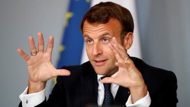French President Emmanuel Macron gestures as he attends an international videoconference on vaccination at the Elysee Palace in Paris on the 49th day of a lockdown in France aimed at curbing the spread of COVID-19, caused by the novel coronavirus. 