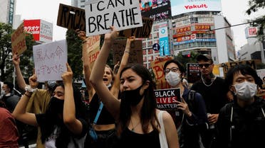 People wearing face masks march during a Black Lives Matter protest following the death in Minneapolis police custody of George Floyd, in Tokyo, Japan June 14, 2020. (Reuters)