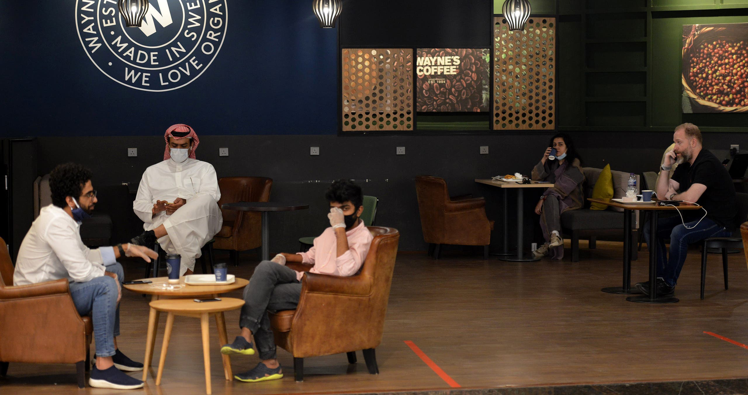 Saudi Arabians at a cafe in the mall in Riyadh, June 4, 2020. (AFP)