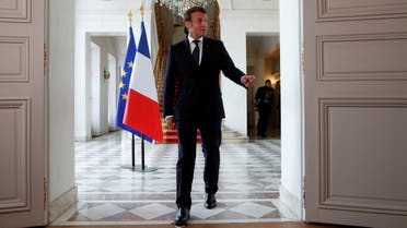 French President Emmanuel Macron gestures as he delivers a statement after an international videoconference on vaccination at the Elysee Palace in Paris on the 49th day of a lockdown in France aimed at curbing the spread of COVID-19, caused by the novel coronavirus. 