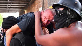 Black Lives Matter protester carries injured white counter-demonstrator to safety