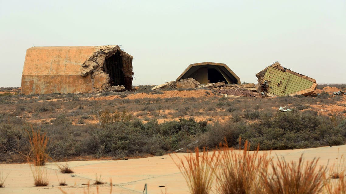 This picture taken on May 18, 2020 shows a view of a destroyed hangar at Al-Watiya airbase also known as Okba Ibn Nafa airbase southwest of the capital Tripoli, after the strategic location was seized by forces loyal to Libya's UN-recognised Government of National Accord (GNA). Libya's UN-recognised government scored another battlefield victory Monday against strongman Khalifa Haftar, capturing the key rear base used by his fighters in a conflict now in its second year. Haftar, who controls swathes of eastern Libya, launched an offensive in April last year against the capital Tripoli, seat of the UN-recognised Government of National Accord (GNA).
