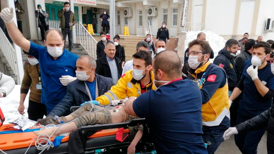 Medics and rescue workers carry a wounded boy to an ambulance after an earthquake hit villages in Baskale town in Van province, Turkey, at the border with Iran, Sunday, Feb. 23, 2020. (AP)