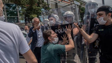 HDP deputy Tuma Celik clash with Turkish riot police in Istanbul, on June 15, 2020. (AFP)