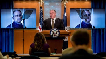 In this file photo taken on June 10, 2020 an image of Paul Whelan is displayed behind Secretary of State Pompeo during a news conference in Washington, DC. (AFP)