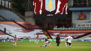 General view as players of Aston Villa and Sheffield United kneel in support of the Black Lives Matter campaign before the match as play resumes behind closed doors. (Reuters)