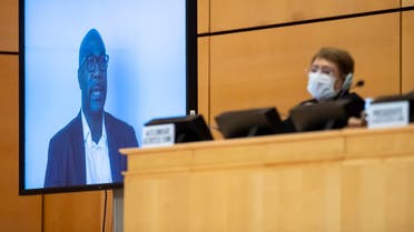 United Nations High Commissioner for Human Rights Michelle Bachelet (R) looks on next to a TV screen showing George Floyd's brother, Philonise Floyd speaking via video message on June 17, 2020 in Geneva. (AFP)