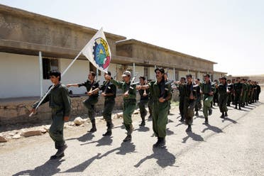 Pesmerga of the Democratic Party of Iranian Kurdistan (PDKI) march during military training at camp Koysancak in Sulaymaniyah in Iraq, 13 August 2005.  (AFP)