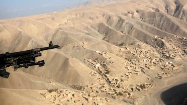 A US helicopter flies near the gold mine site in Nor Aaba in Takhar province, November 26, 2010. (Reuters)