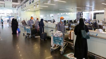Passengers talk to airline employees at Riyadh International Airport, after Saudi Arabia reopened domestic flights, following the outbreak of the coronavirus disease (COVID-19), in Riyadh, Saudi Arabia May 31, 2020. (Reuters)