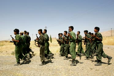 Pesmerga of the Democratic Party of Iranian Kurdistan (PDKI) train during military training at camp Koysancak in Sulaymaniyah in Iraq, 13 August 2005. (AFP)