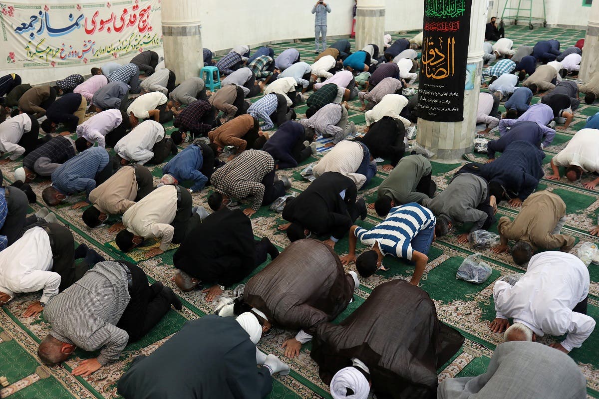 Iranian worshippers attend the Friday prayers in Qarchak Jamee Mosque while maintaining social distancing, following the outbreak of the coronavirus disease (COVID-19), in Tehran province, in Qarchak. (Reuters)