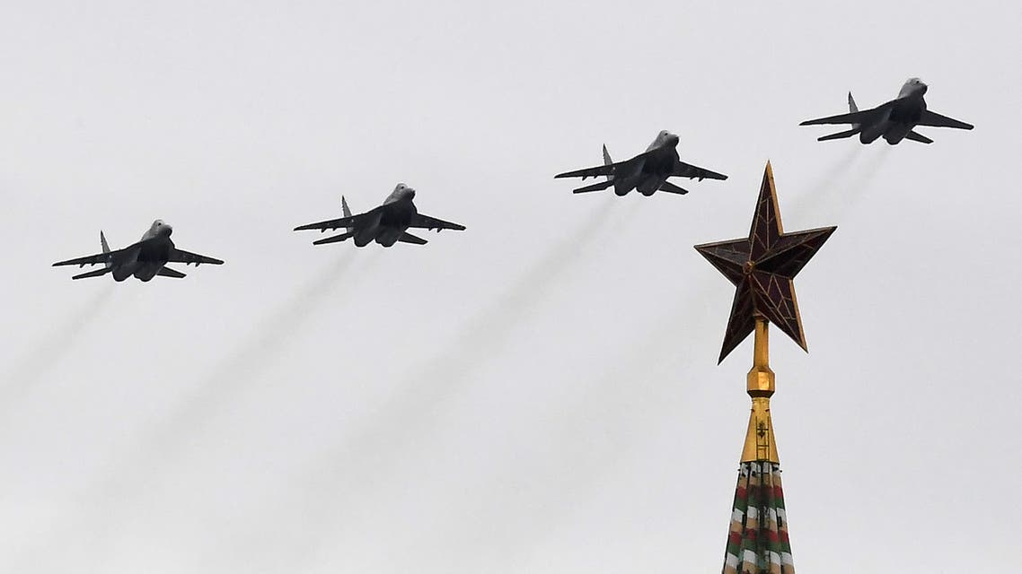 Russian MiG-29 jet fighters fly over the Kremlin and Red Square in downtown Moscow to mark the 75th anniversary of the victory over Nazi Germany in World War Two, May 9, 2020. 