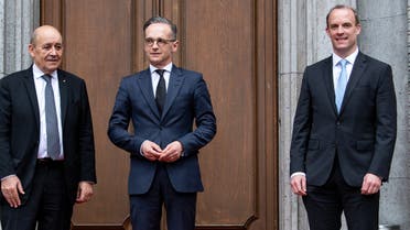 German Foreign Minister Heiko Maas (C), his French counterpart Jean-Yves Le Drian (L) and Britain's Secretary of State Dominic Raab (R) pose before talks at Villa Borsig in Berlin on June 19, 2020. 