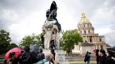 Anticolonial activists cover French military commander Joseph Gallieni statue with a black cloth, in Paris, Thursday, June 18, 2020. Gallieni began a colonial career at the end of the 19th century and later played an important role during First World War as a military governor of Paris. Gallieni used brutal methods to quell rebellion of local populations in French colonies, including as a governor of Madagascar where he abolished the 350-year-old monarchy on the island