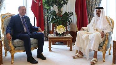 A handout picture provided by the Turkish Presidential Press Service shows Qatar's Emir Sheikh Tamim bin Hamad al-Thani (R), meeting with Turkish President Recep Tayyip Erdogan in the Qatari capital Doha on November 25, 2019. Erdogan arrived in Qatar today on his first official trip to an Arab country since Ankara's forces intervened in northeast Syria last month against Kurdish fighters.