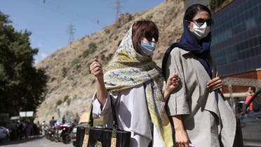 Iranian women wearing protective face masks walk in Darband street, following the outbreak of the coronavirus disease (COVID-19), in Tehran, Iran June 12, 2020. Ali Khara/WANA (West Asia News Agency)/via REUTERS ATTENTION EDITORS - THIS PICTURE WAS PROVIDED BY A THIRD PARTY