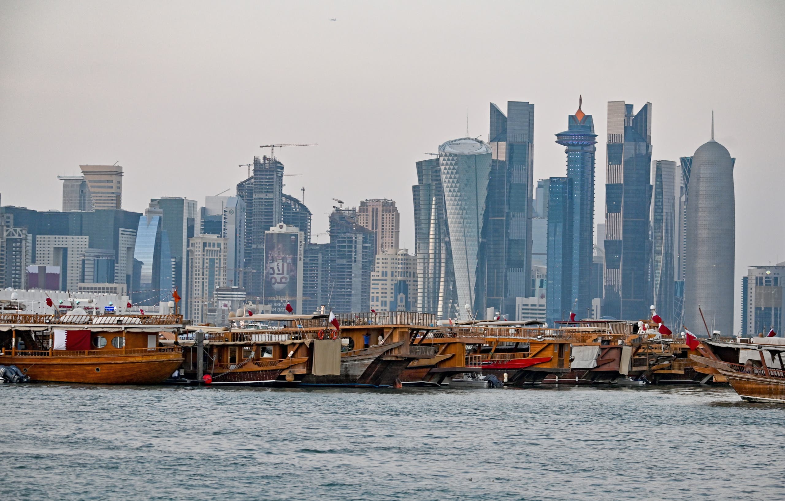 A general view taken on December 20, 2019 shows boats moored in front of the skyline of the Qatari capital, Doha. (AFP)