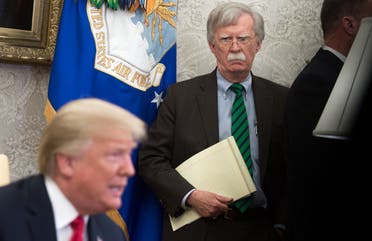In this file photo National Security Adviser John Bolton stands alongside US President Donald Trump as he speaks during a meeting with NATO Secretary General Jens Stoltenberg in the Oval Office of the White House in Washington, DC, May 17, 2018. (AFP)