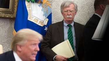 In this file photo National Security Adviser John Bolton stands alongside US President Donald Trump as he speaks during a meeting with NATO Secretary General Jens Stoltenberg in the Oval Office of the White House in Washington, DC, May 17, 2018. (AFP)