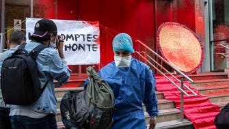 Coronavirus: Protesters douse French health ministry with red paint 