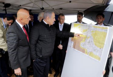 In this Feb. 24, 2020, file photo, Israeli Prime Minister Benjamin Netanyahu checks the area map during visit to Ariel settlement in the West Bank. (AP)