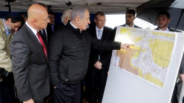 In this Feb. 24, 2020, file photo, Israeli Prime Minister Benjamin Netanyahu checks the area map during visit to Ariel settlement in the West Bank. (AP)