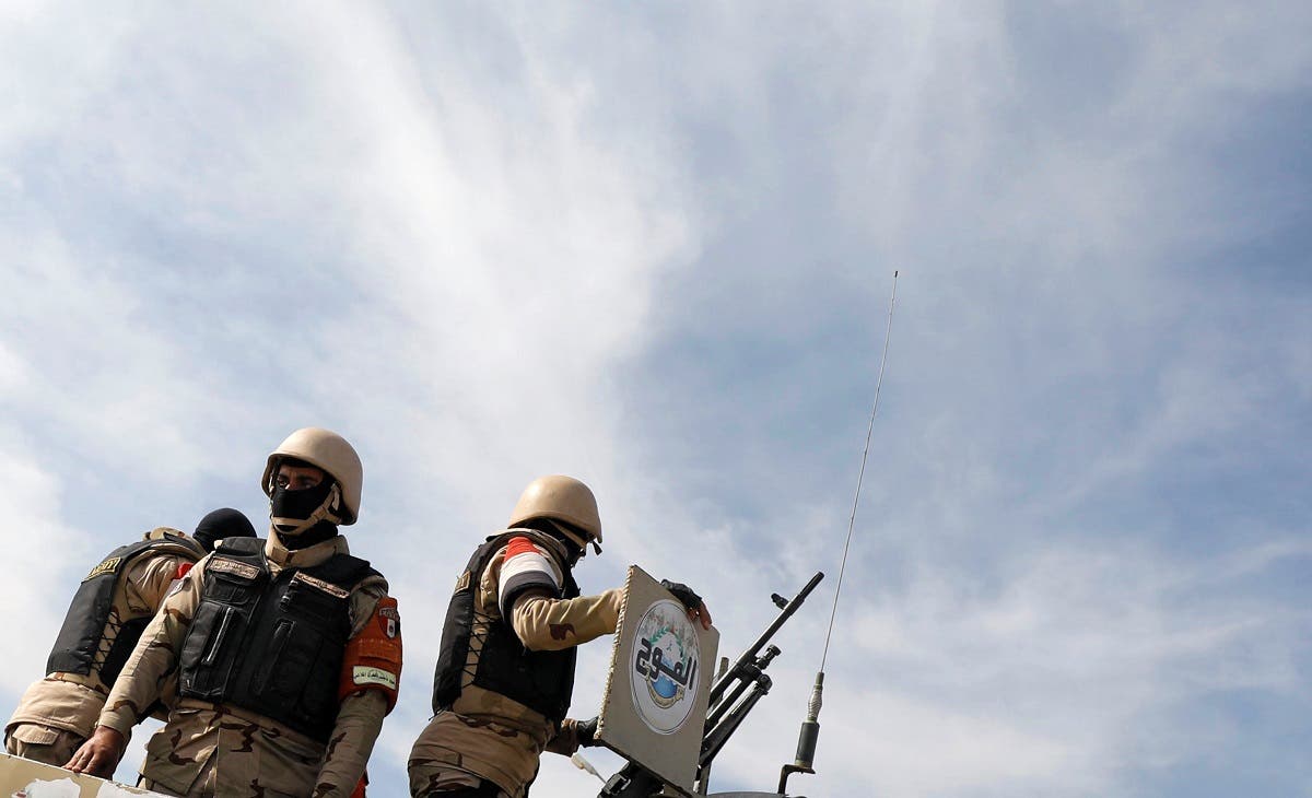 Army soldiers stand guard at the entrance of a tunnel in the Suez Canal area, in Ismailia. (Reuters)