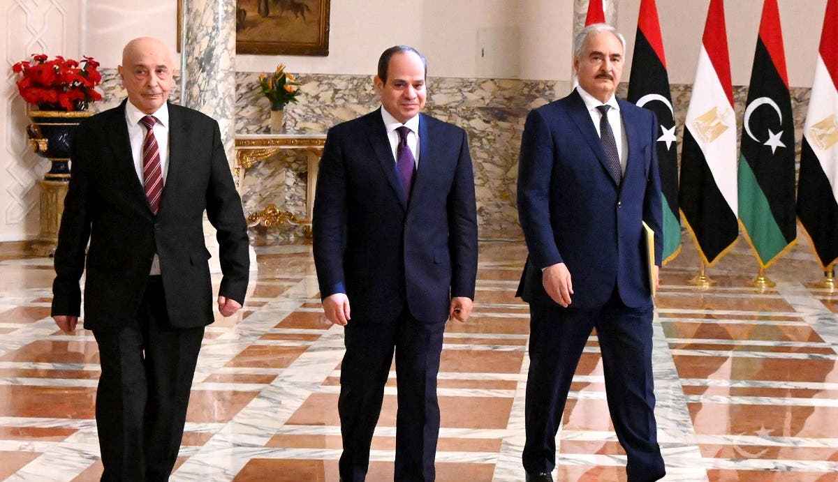 A handout picture released by the Egyptian Presidency on June 6, 2020 shows Egyptian President Abdel Fattah al-Sisi (C), Libyan commander Khalifa Haftar (R) and the Libyan Parliament speaker Aguila Saleh arriving for a joint press conference in the capital Cairo. (AFP)