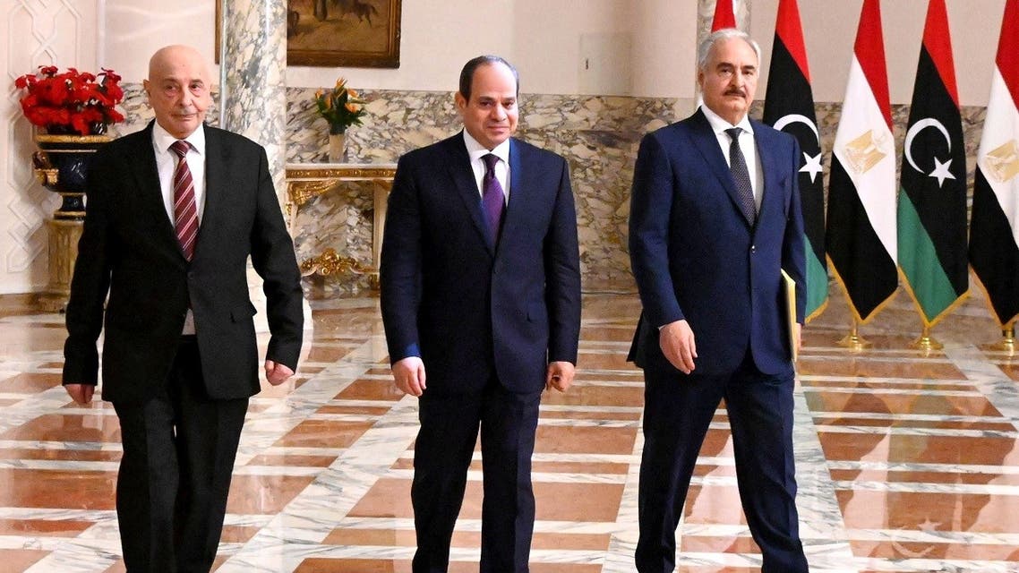A handout picture released by the Egyptian Presidency on June 6, 2020 shows Egyptian President Abdel Fattah al-Sisi (C), Libyan commander Khalifa Haftar (R) and the Libyan Parliament speaker Aguila Saleh arriving for a joint press conference in the capital Cairo. (AFP)
