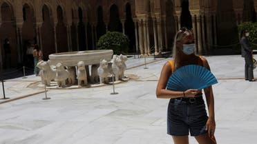 A British tourist stands next to the Lion Fountain in the Court of Lions at Alhambra Palace as it reopens, in Granada, Spain June 17, 2020. (Reuters)